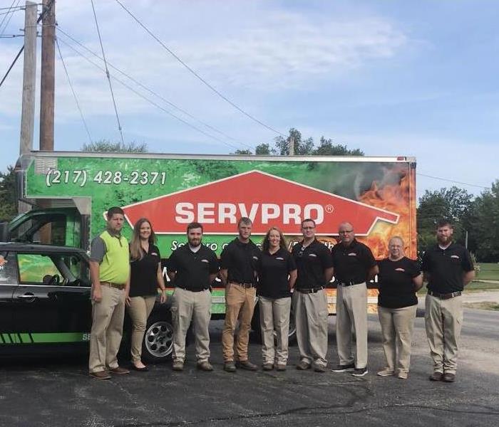 SERVPRO vehicle with team standing in front