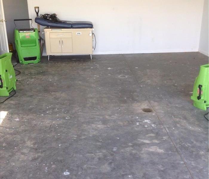 Basement floor with drying equipment.